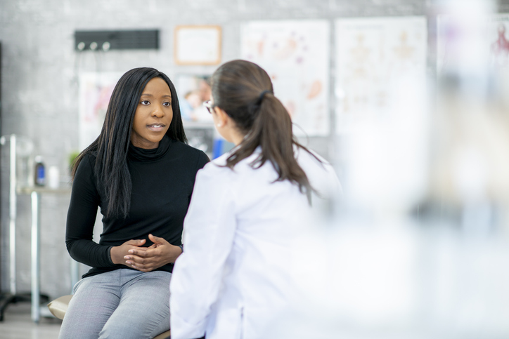 woman talking to doctor